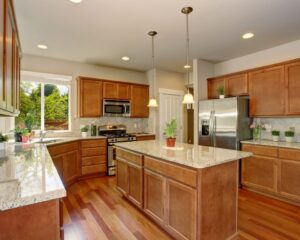 A spacious city kitchen featuring a prominent center island and stylish countertops.
