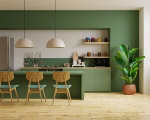 A city kitchen remodel with green walls and wooden floors.