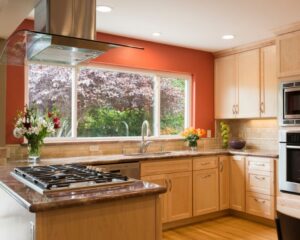 A renovated Venice kitchen with a window and stove top oven.
